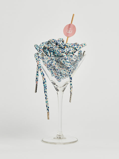 Cordón blanco con flores azules estampadas